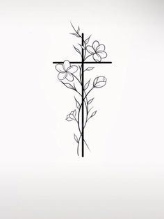 a cross with flowers on it and the word jesus written in black ink above it