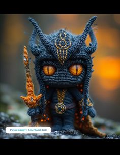 a close up of a figurine with orange eyes