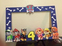 the paw patrol frame has four dogs on it