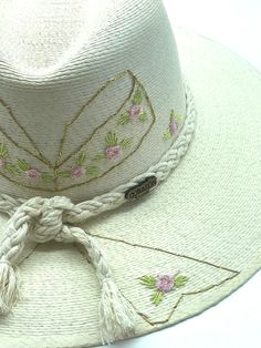 Our exclusive LoveShackFancy inspired hat! Adult hat with Embroidered Bow. Custom designed and hand made hats by artisans in San Jose Del Cabo, Mexico. These hats are one size fits most with an elastic band inside to add comfort and fit for all head sizes. Each hat has a 3-4 week turnaround. Please note, all hats come with natural braid unless custom braid is purchased. Handmade Fedora Hat Band From Toquilla Straw, Handmade Toquilla Straw Fedora With Flat Brim, Bohemian Woven Hats For Kentucky Derby, Handmade Toquilla Straw Hat With Short Brim, Bohemian Panama Hat For Kentucky Derby With Curved Brim, Woven Fedora With Curved Brim For Festivals, Woven Curved Brim Fedora For Festivals, Handmade Adjustable Panama Hat For Spring, Handmade Curved Brim Hat Band For Country Events