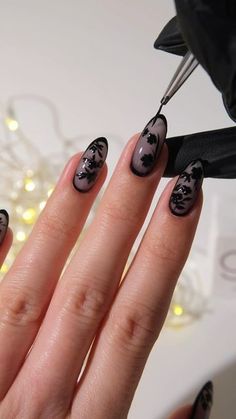 Amber Hancock on Instagram: "AD Dark Florals🖤🥀 The perfect mani for spooky season if Halloween nails aren’t your thing!  Products used @the_gelbottle_inc  Glass Black & Jet black over Bella BIAB   #halloweennails #darknails #blacknails #floralnails #fallnails #nailart #autumnnails dark nails, black nails, Halloween nails, floral nail art" Dark Nails Simple Design, Black And Cat Eye Nails, Black Almond Acrylic Nails Design, Fall Flowers Nail Art, Dark Feminine Energy Nails, Simple Black Gel Nails, Dark Style Nails, Glass Black Nails, Black Nails Flower Design