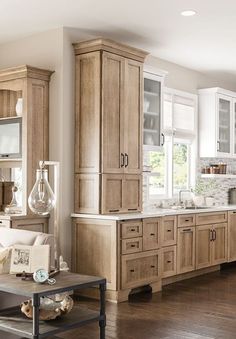 a large kitchen with wooden cabinets and white appliances