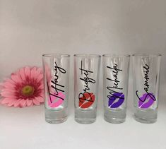 three shot glasses with lipstick painted on them and the words happy birthday written in different colors