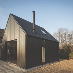 a house with a metal roof and windows