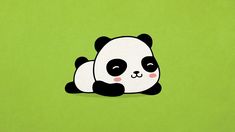 a panda bear laying down on top of a green surface with its eyes wide open