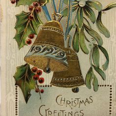 an old fashioned christmas card with a bell and holly leaves on the front, surrounded by red berries