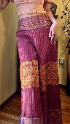 Pants made from ancient hand-woven Thai  silk with rare patterns. Bohemian style design and unique. Suitable for  summer wear, beach sea side. Outdoor activities or barbecue areas. Elastic waist size can stretch 30-36 inches,  hip 40 inches, length 38 inches , Lined with adhesive cloth inside. Traditional Style Bottoms For Summer Vacation, Traditional Bottoms For Summer Vacation, Traditional Summer Bottoms For Vacation, Bohemian Stretch Ankle-length Pants, Traditional Summer Vacation Bottoms, Bohemian Stretch Straight Pants, Bohemian Multicolor Wide Leg Pants, Bohemian Stretch Harem Pants For Beach, Stretch Wide-leg Harem Pants For Beach