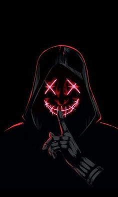 a person wearing a mask and holding a finger up to their mouth in the dark