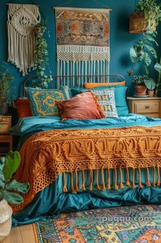 a bedroom with teal walls and lots of plants