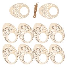 wooden cutouts and string for crafts on white background