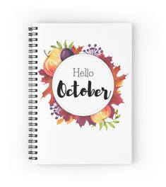 a spiral notebook with the words hello october on it