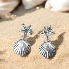 Dive into the beauty of the ocean with our stunning 925 sterling silver shell and starfish earrings. Crafted with love and attention to detail, these delicate ocean-inspired earrings are the perfect accessory for those who cherish the sea. Each pair measures 9/32 inches in width and 19/32 inches in length, making them lightweight and comfortable for everyday wear. Whether you're dressing up for a special occasion or simply adding a touch of elegance to your everyday outfit, these earrings are versatile enough to bring a little ocean charm to any look. Our earrings are beautifully handcrafted from premium 925 sterling silver, ensuring durability and a lasting shine. Each piece is stamped with "925," a testament to its quality and authenticity. The intricately designed shell and starfish mot Silver Drop Earrings With Starfish Charm, Silver Ocean-inspired Earrings With Starfish Charm, Ocean-inspired Silver Earrings With Starfish Charm, Sterling Silver Starfish-shaped Earrings With Charm, Sterling Silver Starfish Charm Earrings, Silver Earrings With Starfish Charm As Gift, Sterling Silver Starfish Earrings With Charm, Sterling Silver Starfish Earrings, Silver Starfish Charm Earrings For Beach