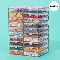 a stacking container filled with lots of different types of candy