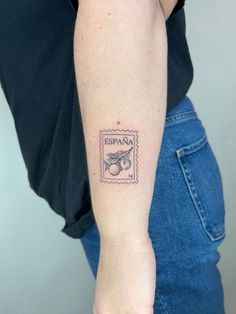 a woman's arm with a stamp on it that says espana in spanish