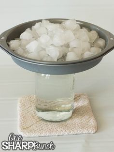 ice cubes are in a bowl on a coaster