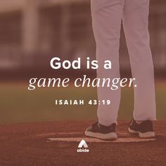 a man standing on top of a baseball field with the words god is a game changer