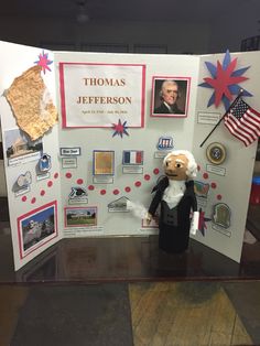 a display case with an american flag and pictures on it