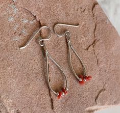 "Cute, Southwestern, and versatile dangle earrings that are handcrafted by me! These earrings are cute and comfortable, making it ideal for everyday wear. They would be a beautiful addition to your outfit as they add a Southwestern vibe! The stone is genuine Italian Red Coral derived from Italy. All findings are 925 sterling silver. Measurements: 1.75\" long and 10mm wide. The Italian Red Coral is 2x5mm. The earrings are dangle earrings with an ear wire. Handcrafted in the USA. The earrings will Southwestern Red Drop Earrings, Southwestern Red Dangle Earrings, Red Southwestern Dangle Earrings, Southwestern Style Red Dangle Earrings, Nickel-free Southwestern Red Earrings, Nickel-free Red Southwestern Earrings, Southwestern Style Red Nickel-free Earrings, Handmade Southwestern Dangle Teardrop Earrings, Handmade Southwestern Teardrop Dangle Earrings