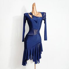 a mannequin with a blue dress on display