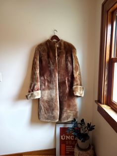 Up for sale is a vintage Laskin Mouton dyed lamb authentic fur coat. Overall the coat is in wonderful condition with no major rips, tears, or stains. There is some minor distress to the fur (see photos) but this is minor. There is a tiny tear on the interior lining. The neck lining rides up a little high on the neck and the top button seems irrelevant as it would be difficult to button. There is one clasp in the middle of the coat to close the jacket. Laskin Mouton Dyed Lamb Estimated size: Men's Medium / Women's L to XL Measured flat: Inches long: 39 1/2 Inches pit to pit: 22 Inches shoulder to shoulder: About 21  Inches cuff to shoulder:  About 27 Inches cuff to neck: Vintage Outerwear With Faux Fur Lining And Long Sleeves, Vintage Brown Outerwear With Faux Fur Trim, Vintage Long-sleeved Faux Fur Coat, Vintage Long Sleeve Fur Coat With Faux Fur Lining, Brown Vintage Fur Coat With Faux Fur Trim, Vintage Fur Coat With Faux Fur Lining For Fall, Vintage Faux Fur Trim Coat For Fall, Vintage Mink Outerwear With Faux Fur Trim, Vintage Winter Fur Coat With Faux Fur Lining