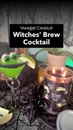 witches'brew cocktail with candles on the table