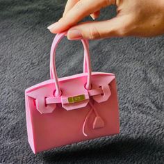 As a hand-made and hand-designed miniature bag, The High Fashion Teeny Purse lets you carry couture fashion in the palm of your hand! A perfect gift for those in your life who value the finer things, and the smaller ones. Small Mobile Phone Bag As Gift, Handmade Handheld Coin Purse For Gift, Rectangular Coin Purse As Gift, Pink Top Handle Bag For Valentine's Day, Handheld Coin Purse As Gift, Pink Shoulder Bag With Handles As Gift, Pink Coin Purse Mobile Phone Bag As Gift, Pink Handheld Bag For Gifting, Pink Coin Purse With Mobile Phone Bag For Gift