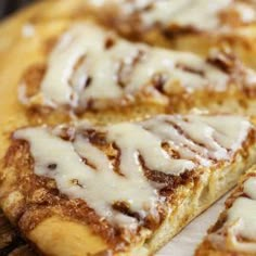 slices of cinnamon roll pizza on a cutting board