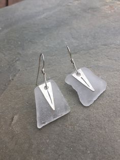 "Beautiful white sea glass pieces that I picked up on the beach, matched and drilled to make these simple, easy going sea glass earrings.  Dangling in front of the sea glass are Hill's Tribe charms - keep the beach in your heart year round! Made with sterling silver wire.  Length is a little over 1 1/2\"." Silver Smithing, Spoon Bracelet, Silver Wrap Ring, White Sea Glass, Earrings Dangling, White Sea, Glass Pieces, Gloucester