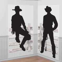 the silhouettes of two men in cowboy hats and boots are painted on white walls