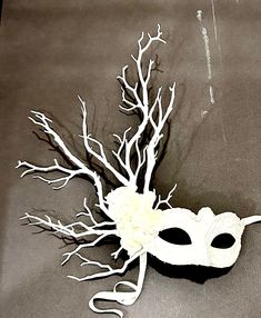 Vegan mask-  NYC Masked ball- Save Venice -Masquerade Ball- Mardi Gras Mask -All white party. Hello,        Made and shipping this one in 1 business day. One of a kind.         Perfect for a masquerade party, birthday celebration, Party celebration, Wedding mask or Mardi Gras. Flowers and branches are  white white.  the branches are made of plastic so they won't break and they're are soft enough so  they are not dangerous.  It's on a very comfortable mask...Adult only. It's a cardboard molded over a plastic mask... makes it durable.  -------------------------------------------------- To return to my shop: https://www.etsy.com/shop/doramarra?ref=si_shop ------------------------------------------------  I ship US Postal Service.       USA DOMESTIC CHOICES  (From mailed date in business days) White Venetian Mask, White Formal Masquerade Mask For Carnival, Venetian White Mask For Costume Party, White Venetian Mask For Costume Party, White Eye Mask For Costume Party, Elegant White Masquerade Mask For Carnival, Venetian White Eye Masquerade Mask, White Masquerade Mask For Halloween, White Masquerade Masks For Carnival