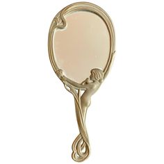 a mirror that is shaped like a female figure