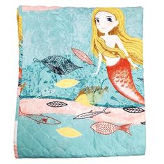 a mermaid themed blanket with fish and dolphins on the bottom, along with an ocean theme