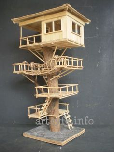 a model of a tree house with stairs on the bottom and second story to the top