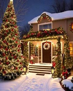 a house decorated for christmas with lights and decorations on the front door, trees and wreaths