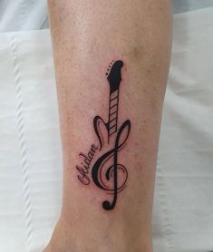 a musical note tattoo on the ankle