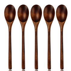 four wooden spoons lined up next to each other