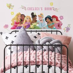 the disney princesses wall decals are on display in this child's bedroom