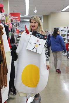 a woman in a costume is walking through a store