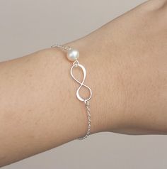 You will receive 2 infinity sterling silver bracelets, each packaged with a very presentable gift box (as pictured) This original design and simply bracelet consists of a sterling silver initial infinity and one customize birthstone. sterling silver chain . ALL STERLING SILVER COMPONENTS Please leave stone choices in your checkout note Elegant Hypoallergenic Jewelry For Mother's Day, Elegant Adjustable Jewelry For Birthday Gift, Minimalist Infinity Bracelets For Gifts, Minimalist Infinity Bracelet As A Gift, Minimalist Infinity Bracelets As Gift, Minimalist Infinity Bracelet For Gift, Elegant White Bracelet For Birthday Gift, Elegant Silver Pearl Bracelet For Mother's Day, Elegant Nickel-free Bracelets For Anniversary