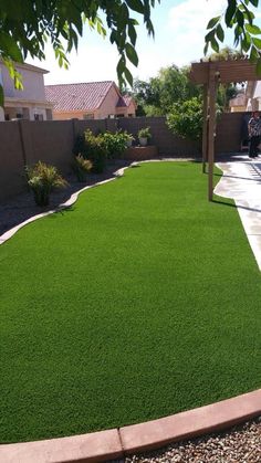 an outdoor area with green grass and gravel