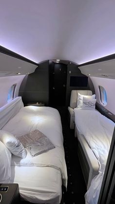 two twin beds in the middle of an airplane