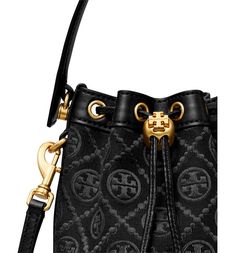 Find TORY BURCH Mini T-monogram Bucket Bag on Editorialist. Logo-jacquard canvas and smooth leather provide textural interplay on this bucket bag featuring a drawstring closure cinched with a logo-embellished toggle. A top handle and removable crossbody strap offer versatile carrying options. Protective metal feet Lined Textile with leather trim Imported Mini Bucket Bag, Mini Bucket Bags, Mini Bucket, Crossbody Strap, Smooth Leather, Leather Trims, Top Handle, Bucket Bag, Tory Burch