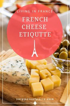 cheese and olives on a cutting board with the words living in france french cheese etique