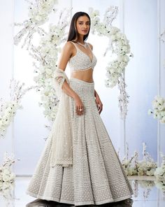 This lehenga set features heavy pearl & sequin embroidery on grey net base. The outfit is paired a sweetheart blouse and an embroidered net dupatta.From Seema Gujral's Tuscan Summer collection. DELIVERY TIMEPlease allow 4 months for your outfit to arrive. FABRIC DETAILSNet Professional cleaning only. Pearl Lehenga, Lavender Lehenga, Tuscan Summer, Seema Gujral, Lehenga Bridesmaid, Sangeet Outfit, Cut Blouse