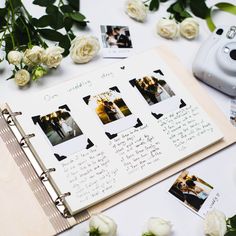 an open wedding album with photos and flowers on the table next to it's camera