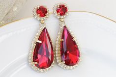 #jewelry #jewelrysets #redhaloearrings #eveningearrings #rhinestoneruby #earringsforwomen #rubyredearrings #statementearrings #redearrings #teardropearrings #redjewelry #chandelierearrings #necklaceearringset #redflowerearrings #teardropbigearring Swarovski Chandelier, Red Statement Earrings, Red Ruby Earrings, Elegant Wedding Jewelry, Blue Bridal Earrings, Wedding Earrings Vintage, Red Chandelier, Emerald Diamond Earrings, Diamond Earrings For Women