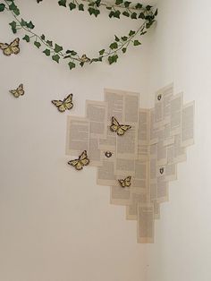 an open book with butterflies on the pages