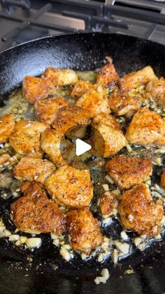 chicken and rice cooking in a skillet on the stove