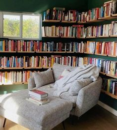 a chair in front of a bookshelf full of books