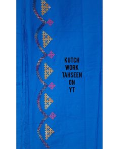 a blue cloth with an embroidered design that says, kutch work tatseen on yy